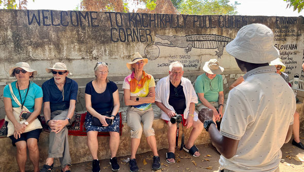 Bajo gives Variety Cruises guests instructions on how to interact with the reptiles.