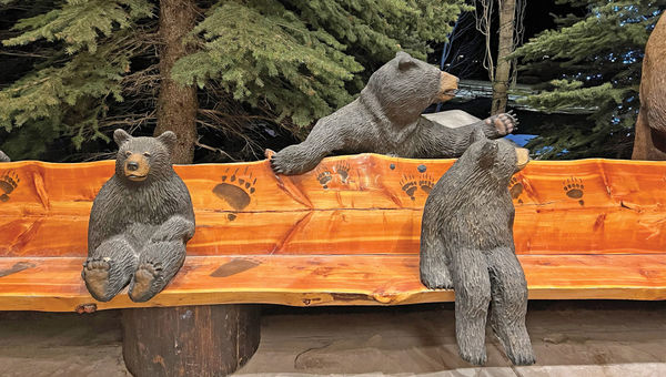 Bears are carved into the bench in the porte-cochere of the Snake River Lodge and Spa in Teton Village.