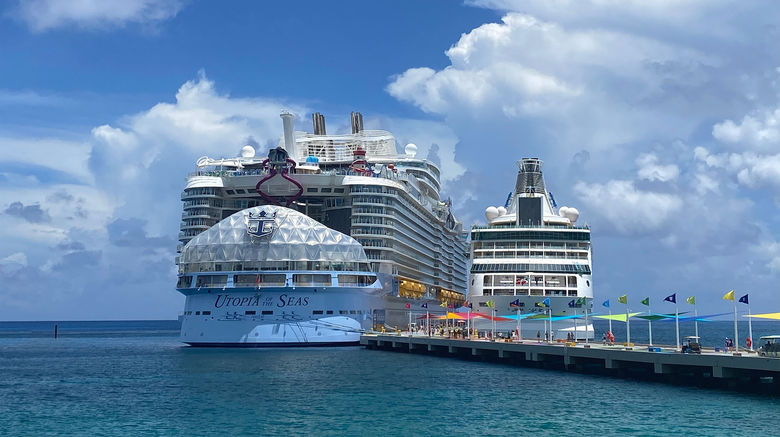 Cruise editor Andrea Zelinski previewed the line's sixth Oasis-class ship prior to its official debut and shares images from the sailing. Pictured, the Utopia of the Seas dwarfs the Vision of the Seas at Perfect Day at CocoCay.