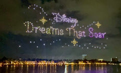 Drones spell out the name of the nighttime show at Disney Springs.