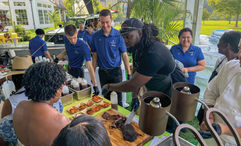 Chef and restaurateur Brian Jupiter serves smoked ribs during The Family Reunion's welcome reception.