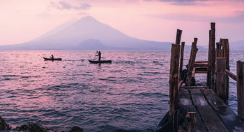 Sunset over the hills of Lake Atitlan in Guatemala, a destination considered a dupe of Italy’s Lake Como by Intrepid Travel, which offers guided tours in the region.