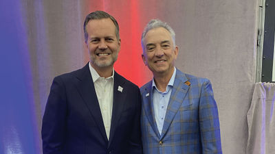 Fred Dixon, while still CEO of New York Tourism & conventions, and his predecessor at Brand USA, Chris Thompson, at the IPW conference in Los Angeles in May.