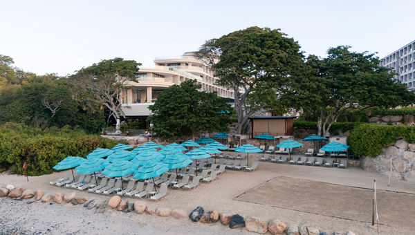 Guests of the resort can take complimentary surf lessons right on the beach.