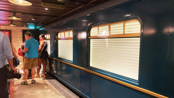 Low ceilings and cement floors help create the illusion of being in an underground train station platform.