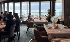 Floor-to-ceiling windows bring the outside inside in La Terrazza, the ship's main dining room.