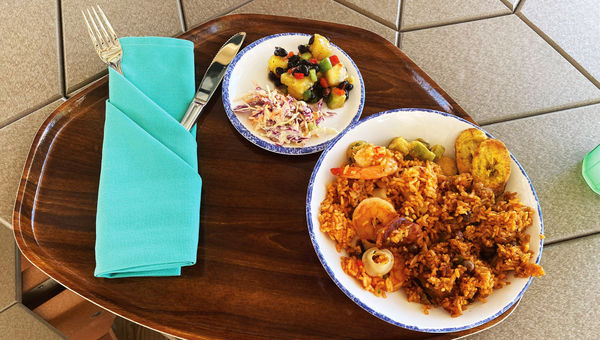 Saffron and vegetable rice with shrimp, mussels and scallops with a side of pineapple black bean salad.