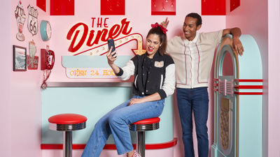 Options in The Selfie Studio: Decades Tour include a 1950s diner setting featuring chessboard flooring, retro wall art, a lunch counter and a jukebox.