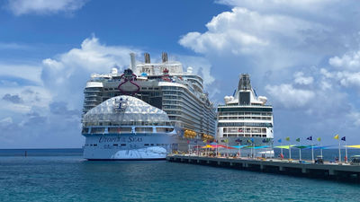 The Utopia of the Seas docked next to the Vision of the Seas at Perfect Day at Coco Cay. The ship will sail the first Travelmation Accessibility Cruise next year.